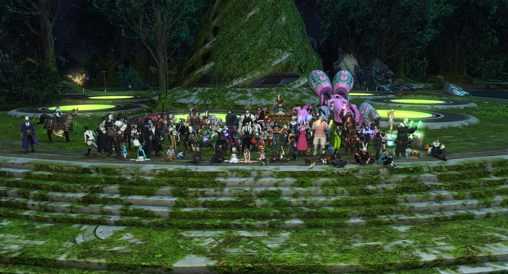 Warriors of Light from Excalibur gather in the newly-reached Sylvan Stacks. An overgrowth of green foliage covers most of the stone surfaces an a second spiraling tower in the background.