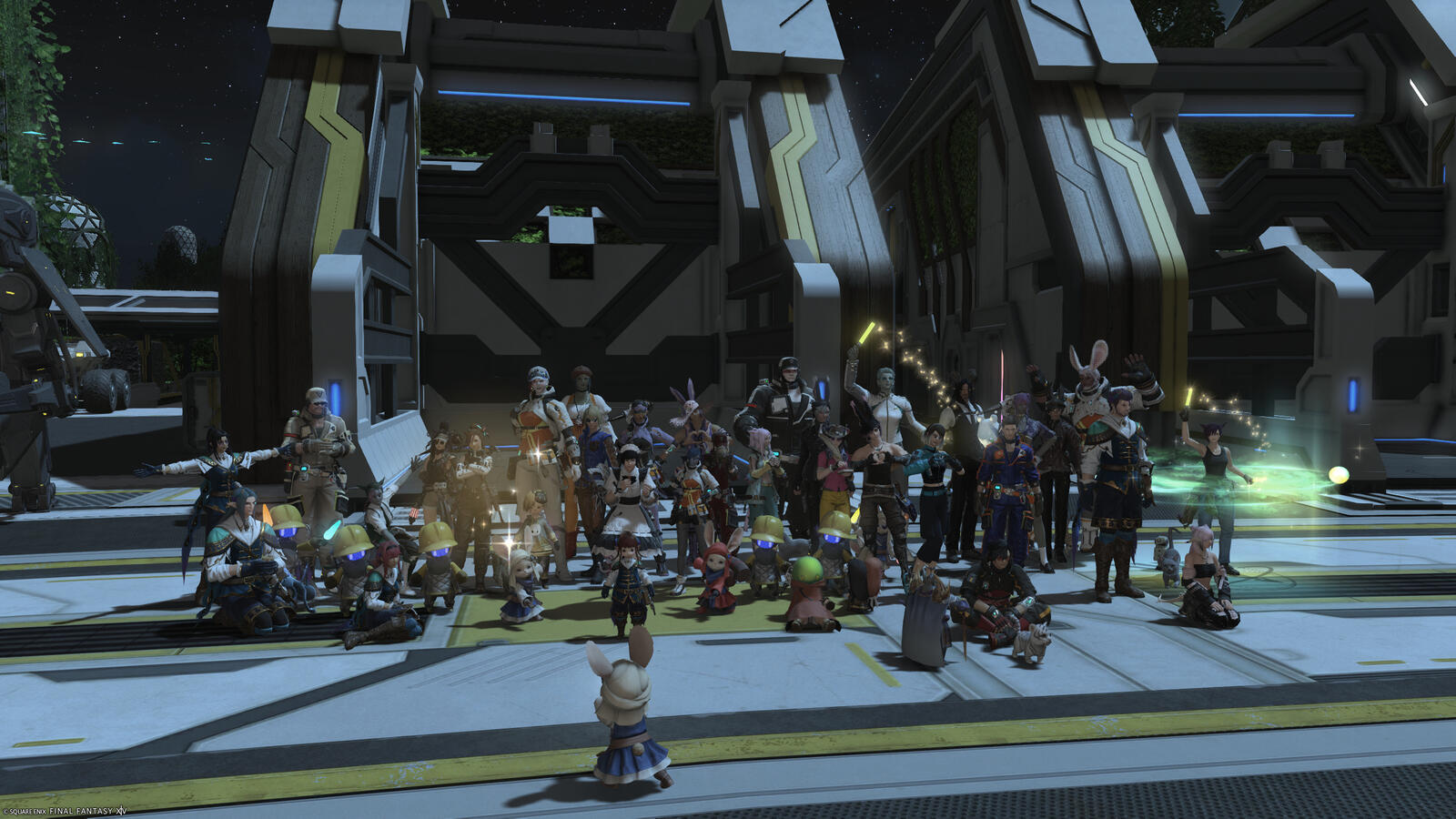 A group of Warriors of Light on Excalibur gather for a group photo at the freshly expanded and upgraded Mech Hangar on Auxesia!